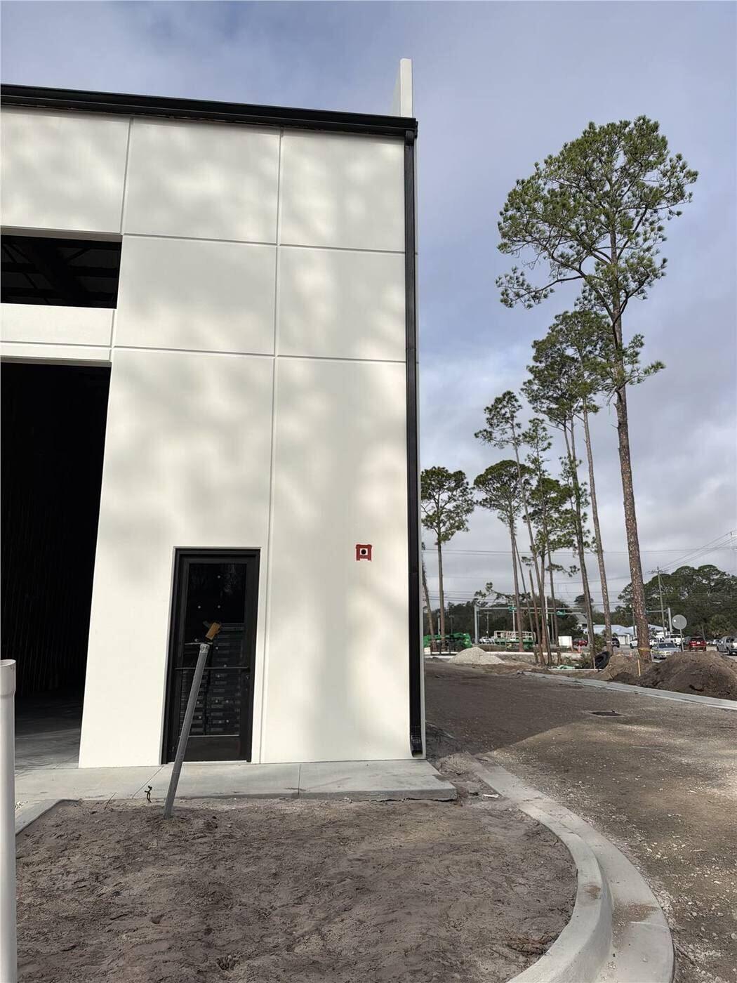 Finished commercial gutter and downspout on a tall building