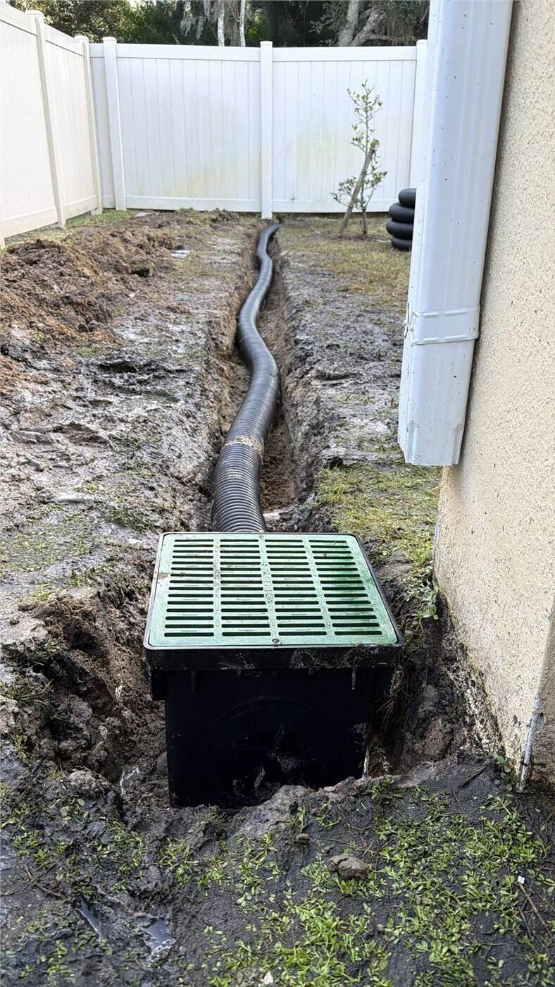 Residential drainage work protecting a North Florida patio and yard